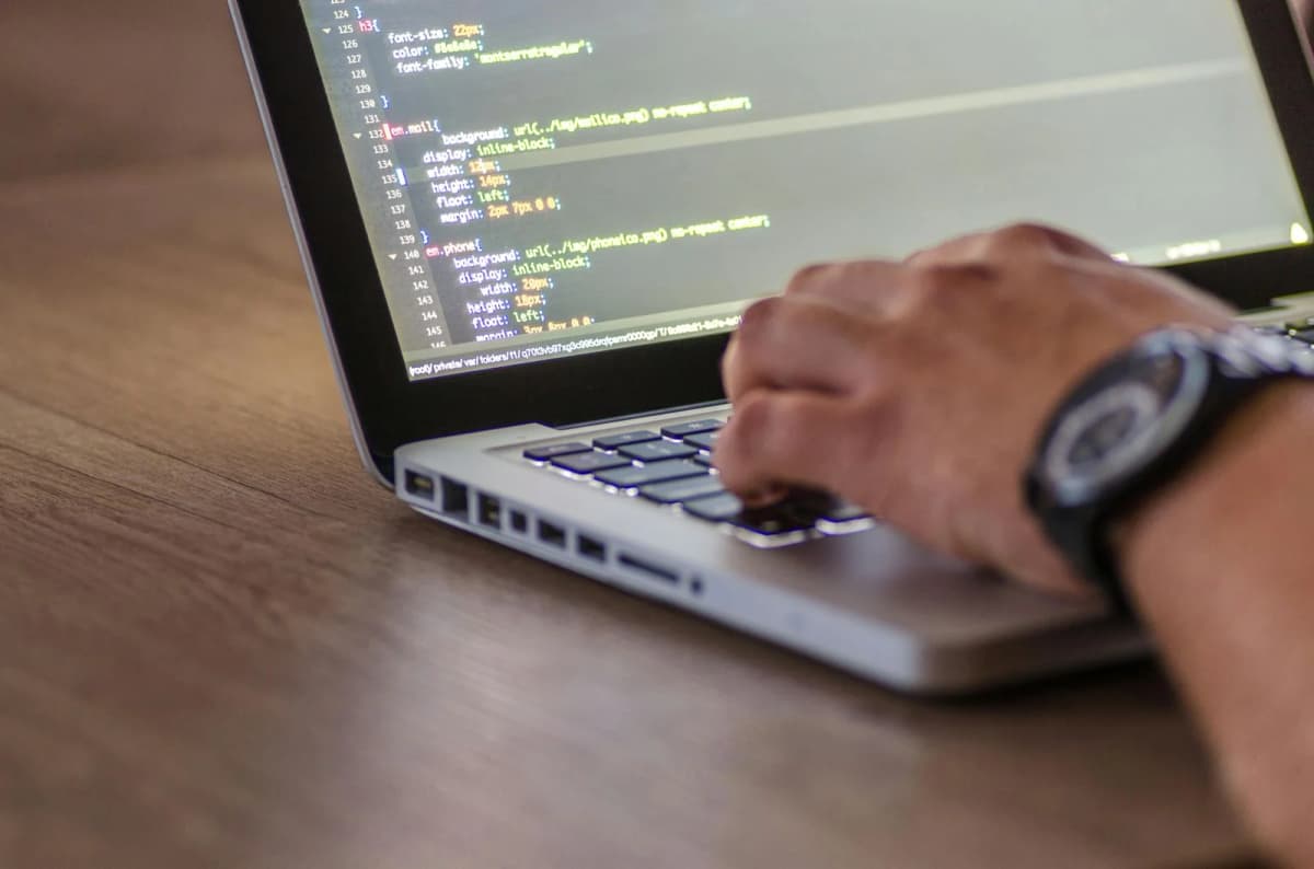Developer coding on computer