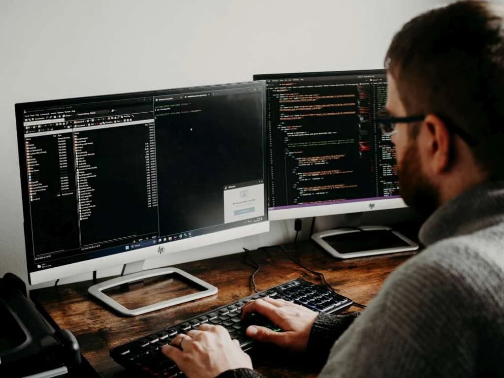 Developer coding on computer
